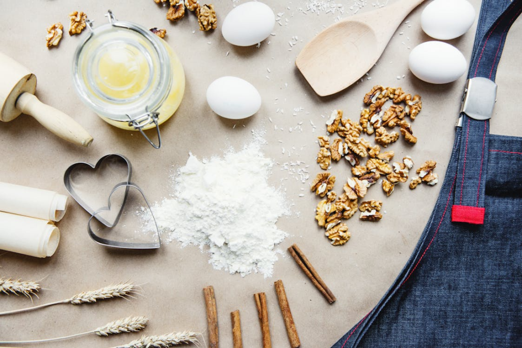 Egg, flour, and other baking essentials on a mat