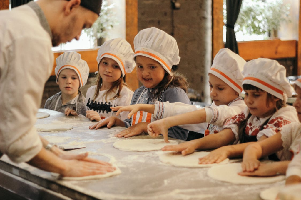 Children in a pizza and baking class